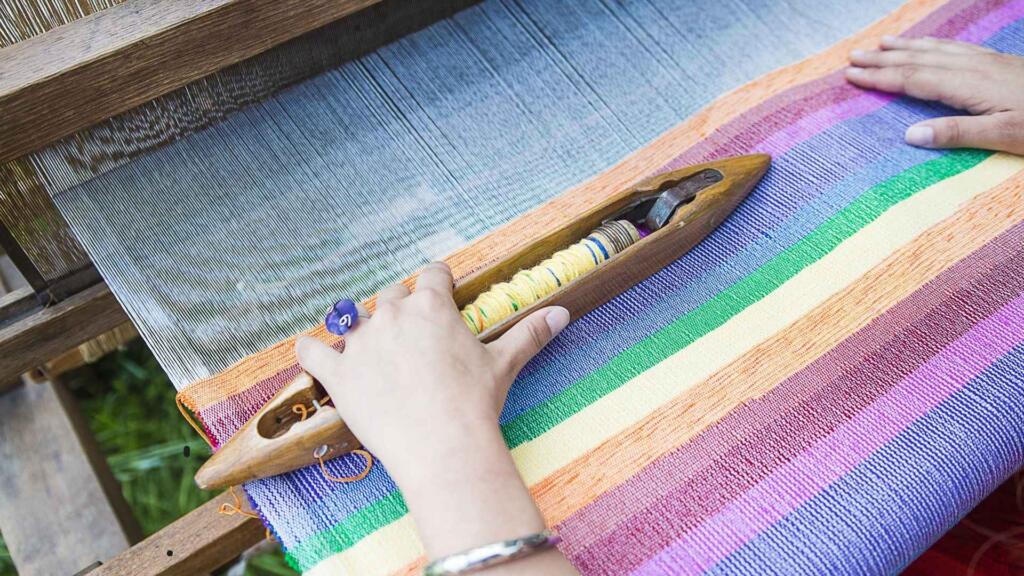 Handloom Weaving with Vibrant Striped Fabric
