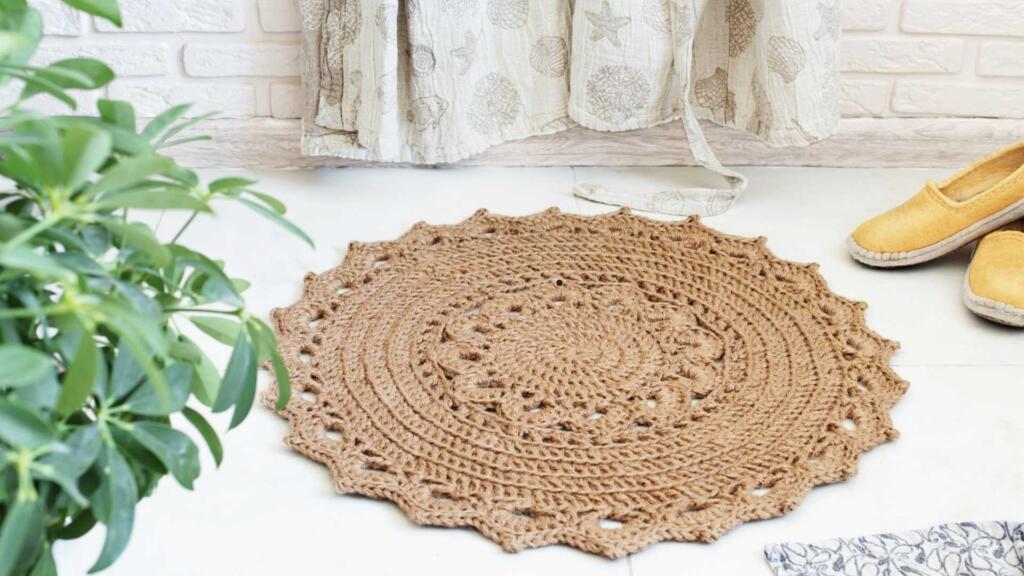 Crocheted jute rug with a lace pattern.