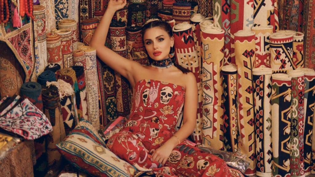a vibrant collection of rolled carpets and rugs, showcasing traditional patterns and cultural artistry.